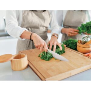Kitchen gadget with logo KEA BOARD Large bamboo cutting board with groove. Size 38x45x1 cm. This natural looking cutting board will look great in any kitchen and is ideal for meal preparation. Whether you cook with meat or vegetables only, you can cut it all on this large board. This board fits right on the edge of your table or counter top so it will stay in place better. Bamboo is a natural product, there may be slight variations in colour and size per item, which can affect the final decoration outcome.  Magnus Business Gifts is your partner for merchandising, gadgets or unique business gifts since 1967. Certified with Ecovadis gold 2022!