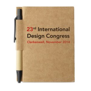 Notebook with logo CARTOPAD Recycled paper notebook with logo and matching pen. Soft paper cover with pen holder. Case-bound. 160 lined pages (80 sheets). Matching push button ball pen in recycled carton and biodegradable plastic. Blue ink. Depending on the surface we can use embroidery, engraving, 360° imprint or screen print.