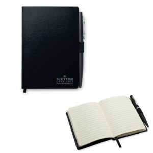 Notebook with logo NOTALUX A6 Notebook with logo and pen. Hard PU cover. Casebound. 144 lined pages (72 sheets). Matching elastic closure strap, ribbon bookmark and pen holder. Matching metal push button ball pen. Blue ink. Dimensions: 14,5X10X1,2CM Width: 10 cm Length: 14.5 cm Height: 1.2 cm Depending on the surface we can use embroidery, engraving, 360° imprint or screen print.