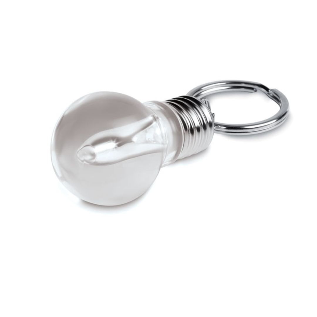 Gadget with logo Key ring ILUMIX Light bulb key ring with white LED light. 3 cell batteries included. Each in a gift box. Available color: Transparent Dimensions: 9X3X2,9 CM Width: 3 cm Length: 9 cm Height: 2.9 cm Volume: 0.111 cdm3 Gross Weight: 0.028 kg Net Weight: 0.02 kg Magnus Business Gifts is your partner for merchandising, gadgets or unique business gifts since 1967. Certified with Ecovadis gold!