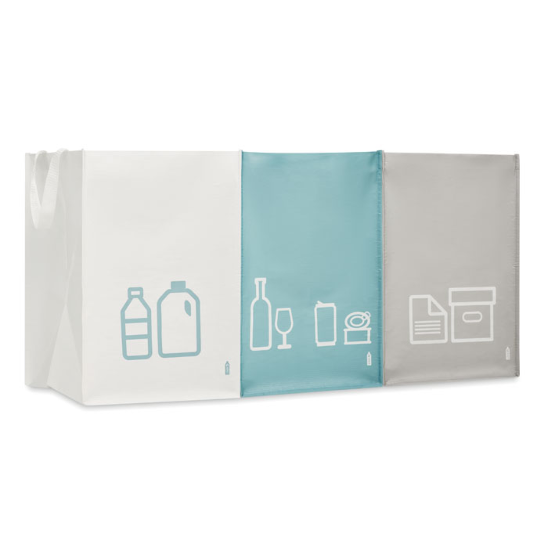 Gadget with logo 3in 1 waste bin THREE BIN Set of 3 RPET non woven laminated recycling bin bags with logo with handles to separate paper, plastic, metal and glass. The bags are connected via hook and loop closure so can be used individually or together. Available color: Multicolor Dimensions: 45X30X30CM Width: 30 cm Length: 45 cm Height: 30 cm Volume: 1.993 cdm3 Gross Weight: 0.348 kg Net Weight: 0.323 kg Magnus Business Gifts is your partner for merchandising, gadgets or unique business gifts since 1967. Certified with Ecovadis gold!