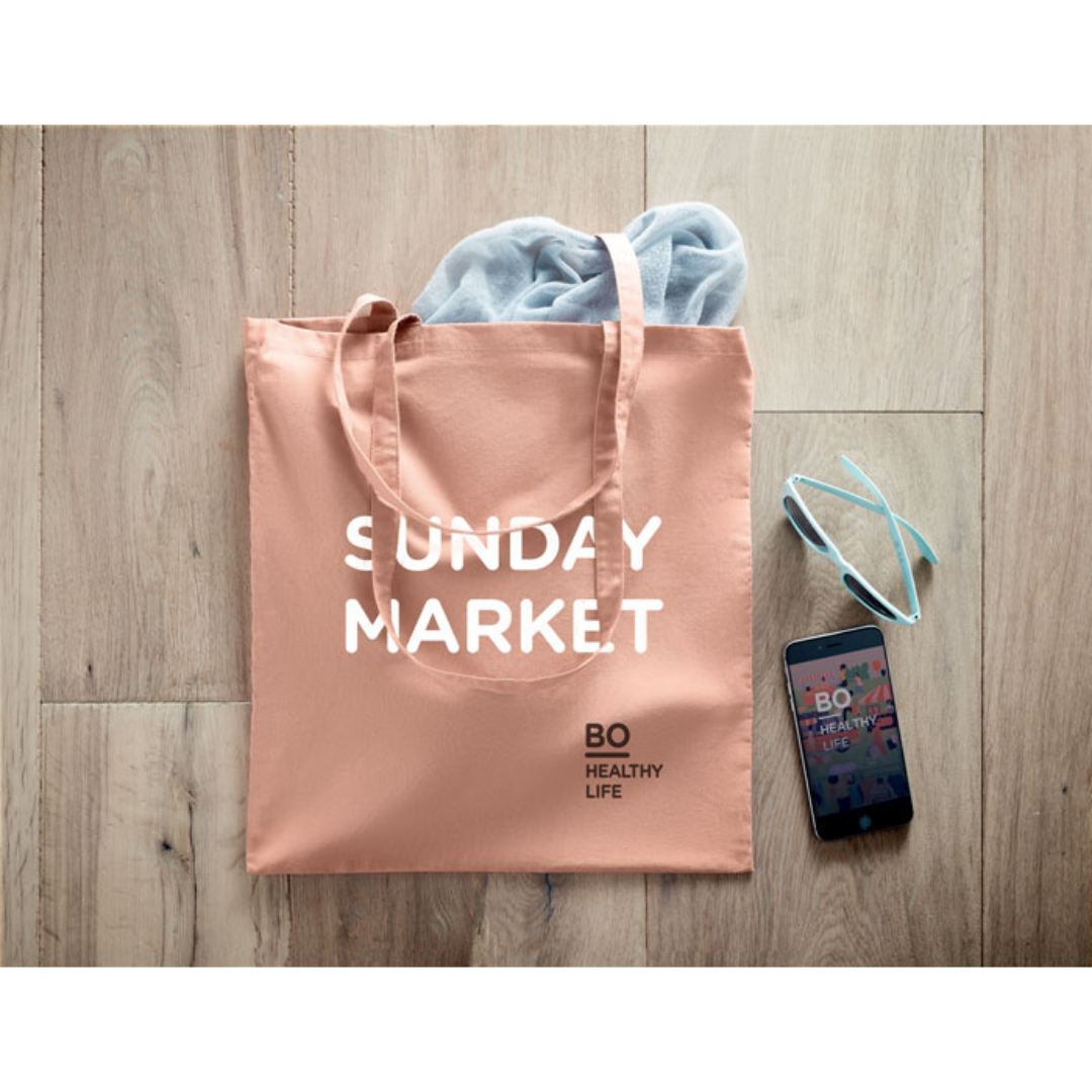 Gadget with logo Bag ZIMDE COLOUR Certified organic cotton shopping bag with logo with long handles. Made from 100% natural organic cotton 140 gr/m². A classic tote bag design made to carry your daily groceries or other items. Carry the bag in your hands or over your shoulder with the long handles. Available color: Orange, Red, Green, Baby Blue, Royal Blue, Blue, White, Dark Grey Magnus Business Gifts is your partner for merchandising, gadgets or unique business gifts since 1967. Certified with Ecovadis gold!