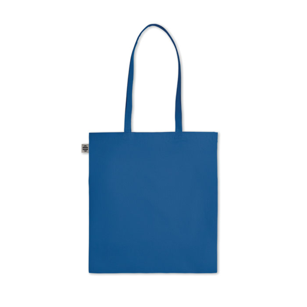Gadget with logo Bag ZIMDE COLOUR Certified organic cotton shopping bag with logo with long handles. Made from 100% natural organic cotton 140 gr/m². A classic tote bag design made to carry your daily groceries or other items. Carry the bag in your hands or over your shoulder with the long handles. Available color: Orange, Red, Green, Baby Blue, Royal Blue, Blue, White, Dark Grey Magnus Business Gifts is your partner for merchandising, gadgets or unique business gifts since 1967. Certified with Ecovadis gold!