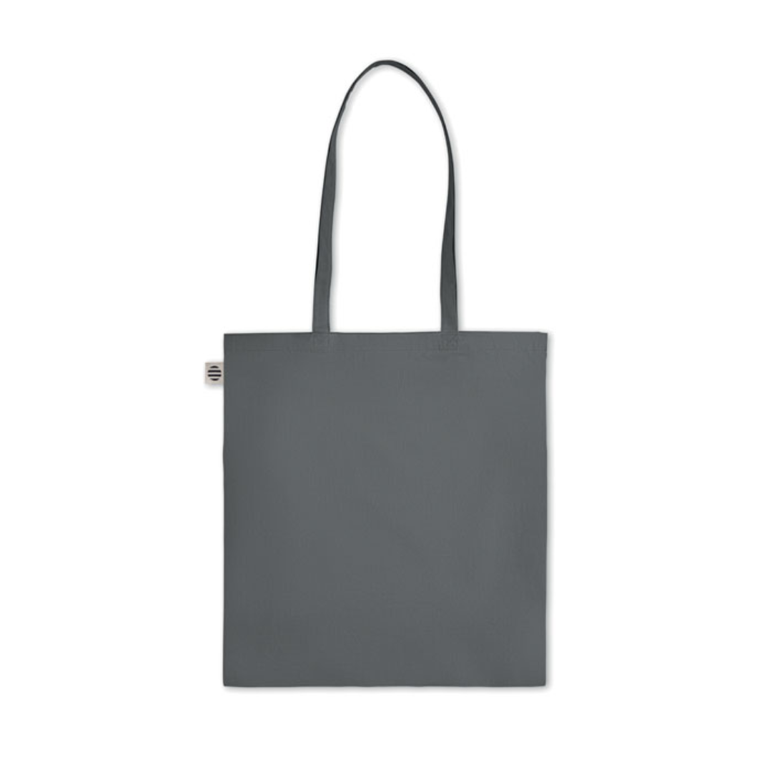 Gadget with logo Bag ZIMDE COLOUR Certified organic cotton shopping bag with logo with long handles. Made from 100% natural organic cotton 140 gr/m². A classic tote bag design made to carry your daily groceries or other items. Carry the bag in your hands or over your shoulder with the long handles. Available color: Orange, Red, Green, Baby Blue, Royal Blue, Blue, White, Dark Grey Magnus Business Gifts is your partner for merchandising, gadgets or unique business gifts since 1967. Certified with Ecovadis gold!