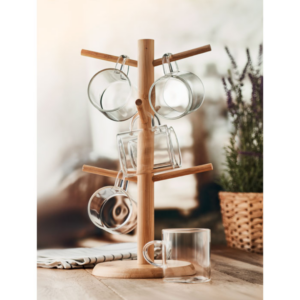 Gadget with logo Bamboo holder set BOROCUPS Set of bamboo cup holder including 6 borosilicate glass cups with logo. Capacity: 200 ml per cup. Product assembly required. You can hang the 6 included glass cups by their handles on the stand. The cups are made from borosilicate glass so they are perfect for warm liquids such as coffee, tea or hot chocolate Dimensions: 19X34CM Width: 34 cm Length: 19 cm Volume: 9.375 cdm3 Gross Weight: 1.328 kg Net Weight: 0.547 kg Magnus Business Gifts is your partner for merchandising, gadgets or unique business gifts since 1967. Certified with Ecovadis gold!