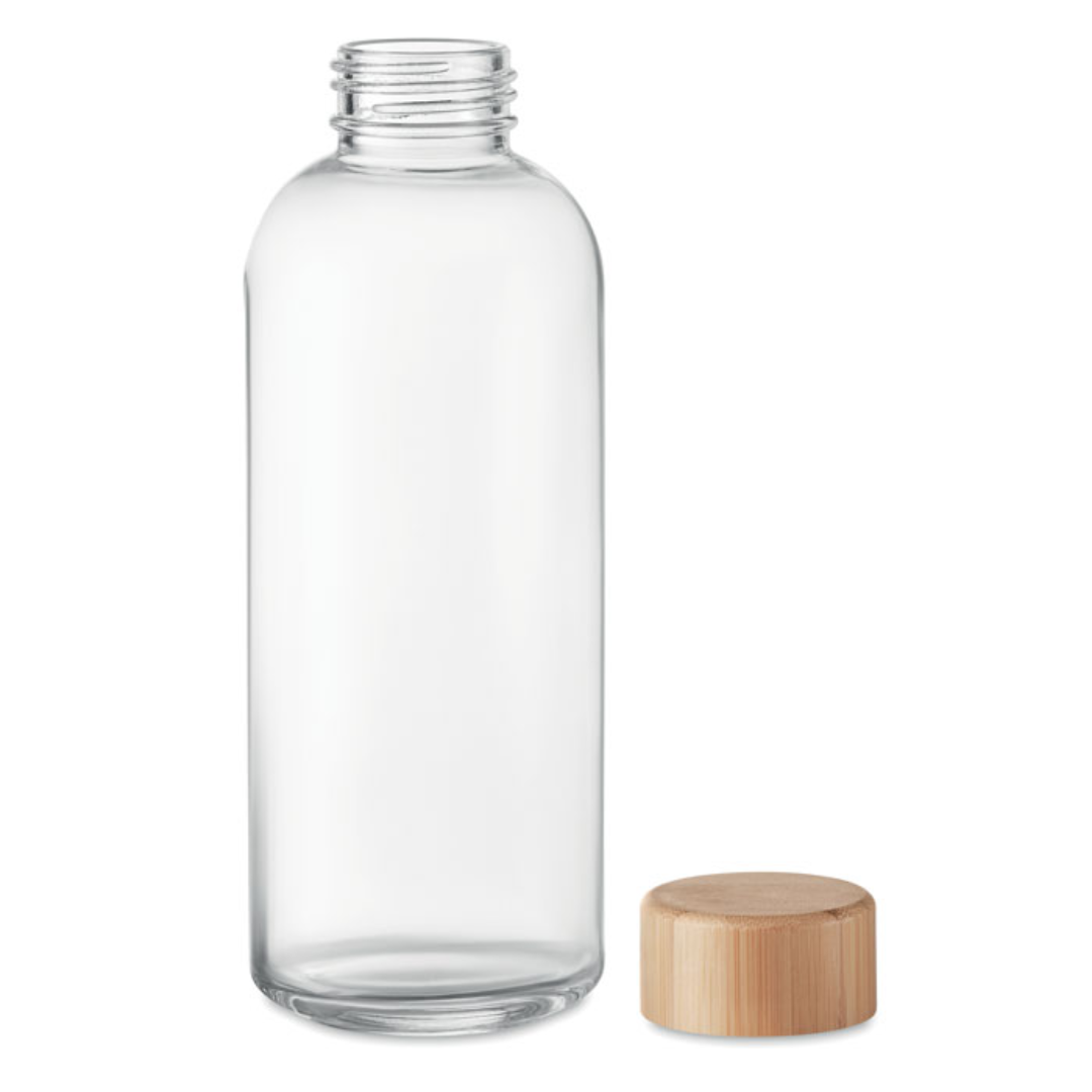 Water bottle with logo FRISIAN Glass water bottle with logo with bamboo lid. Capacity 650 ml. leak free. Keep a water bottle with you during the day to stay hydrated and healthy. The wooden bamboo lid gives this bottle a natural look and makes it stand out more than regular glass bottles. Bamboo is a natural product, there may be slight variations in colour and size per item, which can affect the final decoration outcome. Available color: Transparent Dimensions: Ø7X21CM Height: 21 cm Diameter: 7 cm Volume: 1.467 cdm3 Gross Weight: 0.433 kg Net Weight: 0.327 kg Magnus Business Gifts is your partner for merchandising, gadgets or unique business gifts since 1967. Certified with Ecovadis gold!