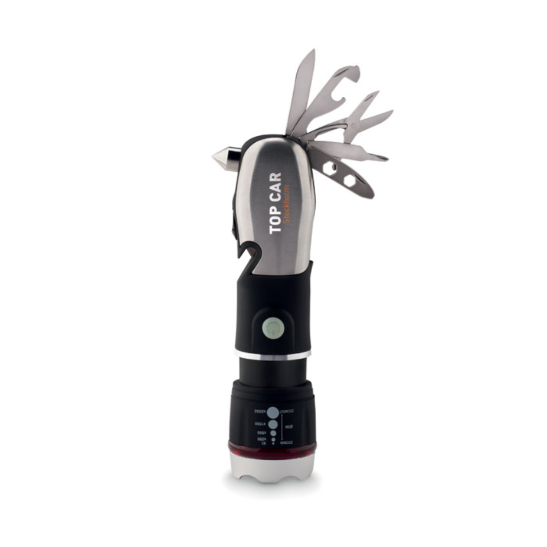 Gadget with logo Multitool HAMLIGHT Multi-tool with logo with torch, safety hammer and cutter. Includes 9 tool functions. ABS with rubberised finish. 3 light settings with zoom function. 3 AAA batteries not included. Available color: Black Dimensions: Ø3,8X16 CM Height: 16 cm Diameter: 3.8 cm Volume: 0.58 cdm3 Gross Weight: 0.186 kg Net Weight: 0.155 kg Magnus Business Gifts is your partner for merchandising, gadgets or unique business gifts since 1967. Certified with Ecovadis gold!