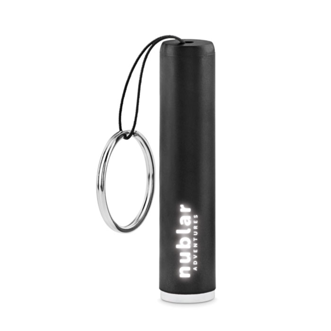 Gadget with logo LED bulb SANLIGHT LED bulb torch in ABS with keyring. The barrel includes a LED light to illuminate the engraved logo. 3 AG3 batteries included. Available color: Royal Blue, Red, Orange, Black, Silver Dimensions: Ø1,3X6,5 CM Height: 6.5 cm Diameter: 1.3 cm Volume: 0.054 cdm3 Gross Weight: 0.013 kg Net Weight: 0.01 kg Magnus Business Gifts is your partner for merchandising, gadgets or unique business gifts since 1967. Certified with Ecovadis gold!