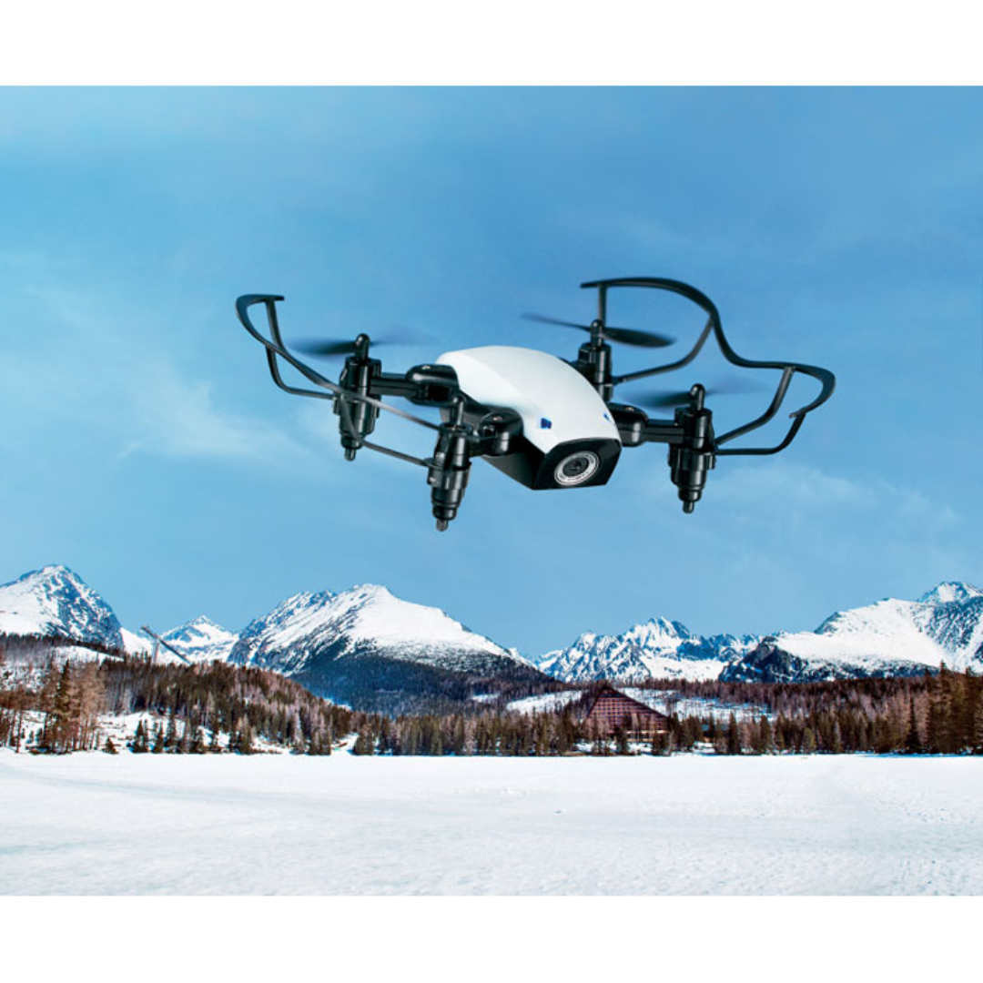 Gadget with logo WIFI drone DRONIE WiFi foldable and rechargeable drone with logo including camera for taking photos and videos. Supplied with remote control unit. You can control the drone with your mobile device via an app. 2 AAA batteries excluded. Rechargeable Li-Ion 200 mAh. Available color: White Dimensions: 9X7X3 CM Width: 7 cm Length: 9 cm Height: 3 cm Volume: 2 cdm3 Gross Weight: 0.278 kg Net Weight: 0.164 kg Magnus Business Gifts is your partner for merchandising, gadgets or unique business gifts since 1967. Certified with Ecovadis gold!