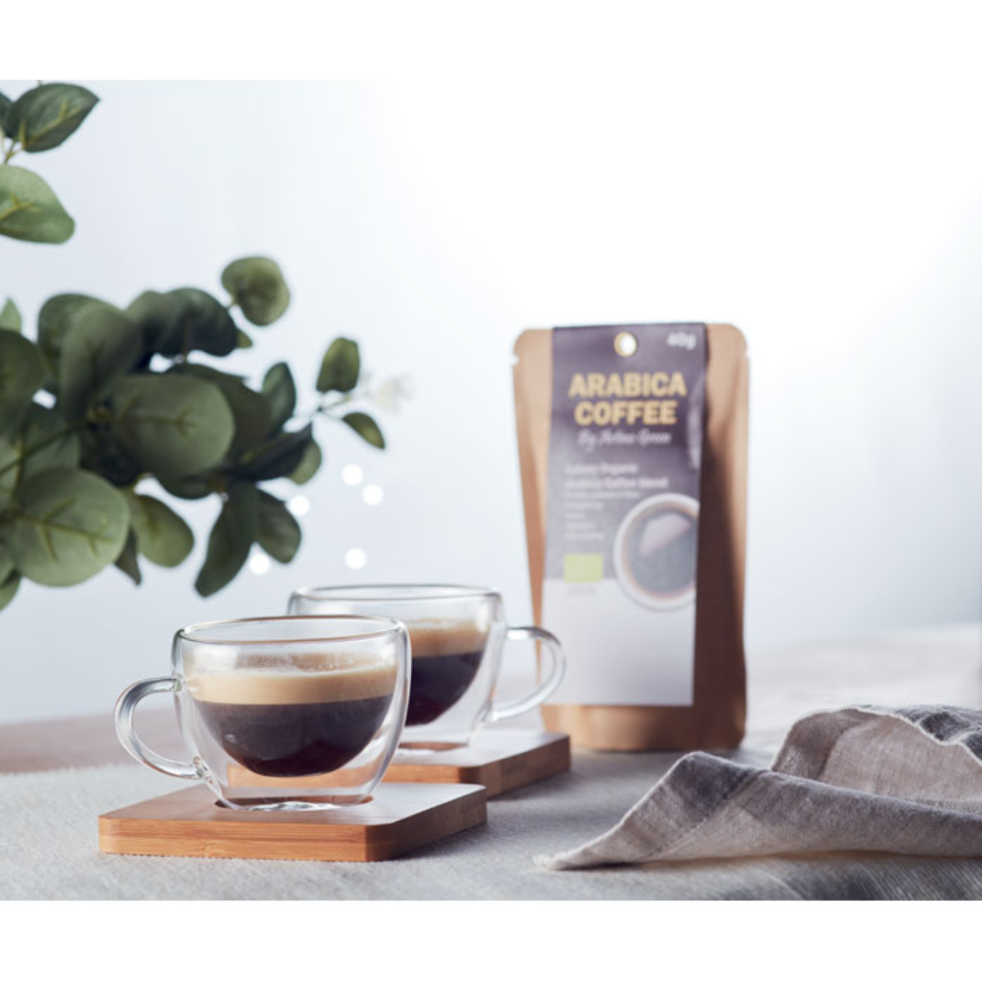 Mug with logo BELIZE Set of 2 double wall espresso glasses with bamboo saucer. Presented in Kraft paper box. Capacity 90 ml. Bamboo is a natural product, there may be slight variations in colour and size per item, which can affect the final decoration outcome. Available color: Transparent Dimensions: 18,5X9,5X6 CM Width: 9.5 cm Length: 18.5 cm Height: 6 cm Volume: 1.804 cdm3 Gross Weight: 0.341 kg Net Weight: 0.223 kg Magnus Business Gifts is your partner for merchandising, gadgets or unique business gifts since 1967. Certified with Ecovadis gold!