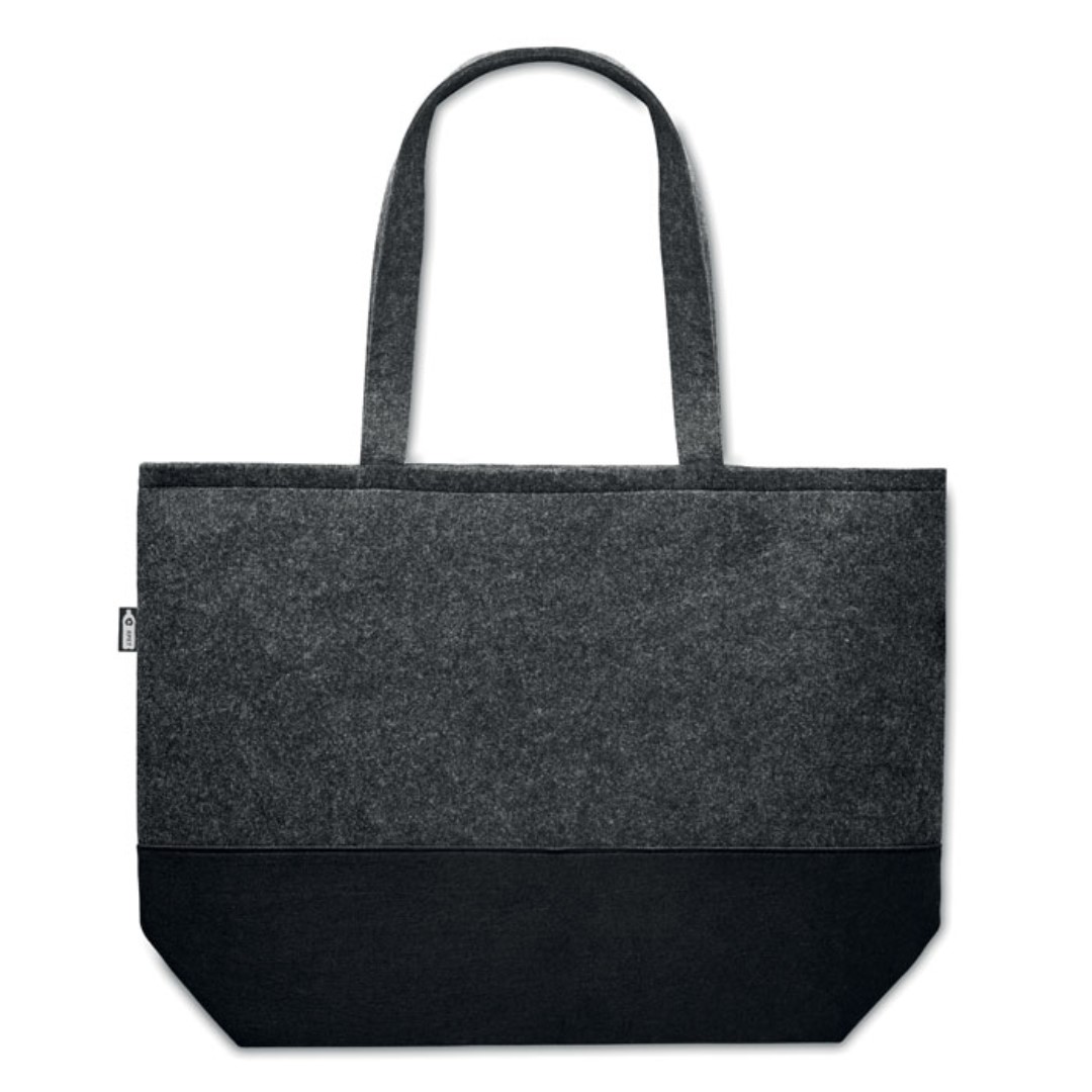 Tote bag with logo DUO INDICO Tote bag with logo in RPET RPET felt shopping bag with long handles and colored base. Depending on the surface we can use embroidery, engraving, 360° imprint or screen print. Magnus Business Gifts anticipated on what society expects today: focus on corporate social respons