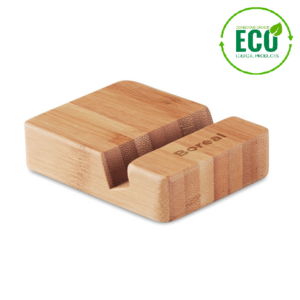 Gadget with logo phone holder in bamboo APOYA Gadget with logo phone holder in bamboo. Available color: Wood Bamboo is a natural product, there may be slight variations in color and size per item, which can affect the final decoration outcome. Dimensions: 7.5X6X2CM Width: 6 cm Length: 7.5 cm Height: 2 cm Volume: 0.146 cdm3 Gross Weight: 0.066 kg Net Weight: 0.057 kg Depending on the surface we can use embroidery, engraving, 360° imprint or screen print.