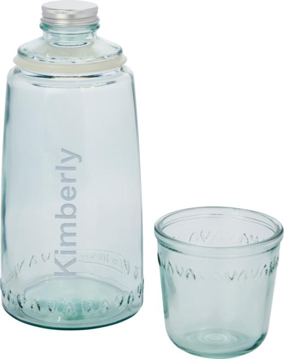 Gadget with logo Glass bottle Vient Gadget with logo, Glass bottle 2-piece recycled glass set featuring one 1000 ml carafe with aluminium lid. Made from 1 glass bottle. 220 ml cup. Recycled glass is manufactured using less energy, raw material, and additives, than what is required for making traditional glass. Available color: Transparent Height: 26 cm, Diameter: 10 cm Weight: 530gr Depending on the surface we can use embroidery, engraving, 360° imprint or screen print.