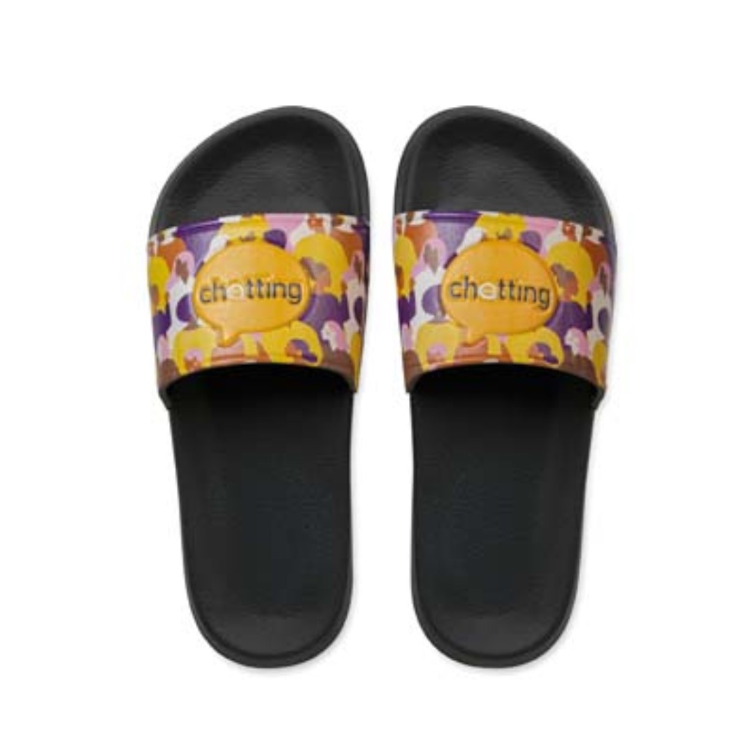 Unisex slippers with logo Unisex slippers with logo in your design for the shower, beach or for daily use at home. The anti-slip EVA slipper can be printed on the PU strap with your 1 colour silkscreen logo or digitally all-over. If you are looking for a truly eye-catching result: combine a digitally printed strap with debossed outlines. Packaging: each pair is wrapped in tissue paper. Sizes 36-45.