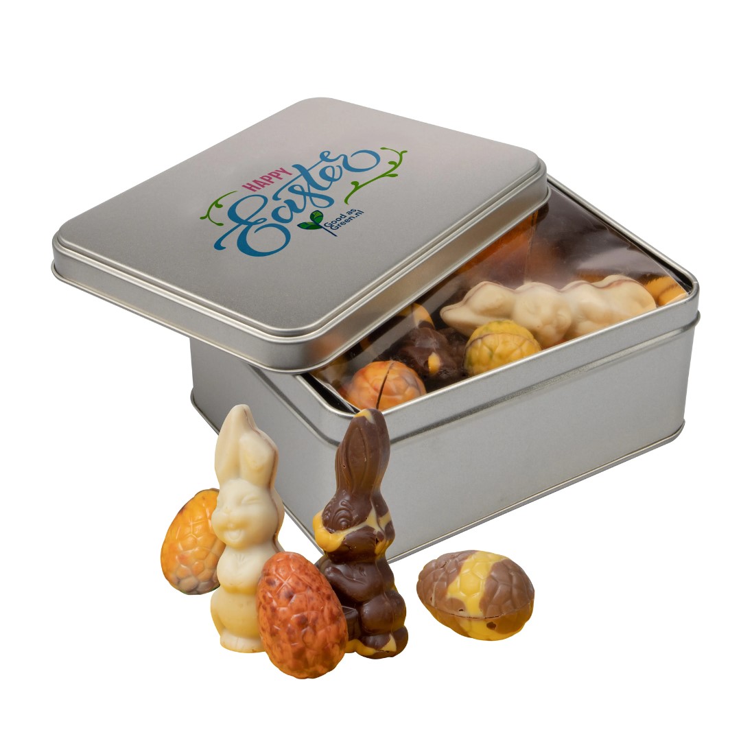 Rectangle tin Easter chocolate with logo Elevate your Easter festivities with this charming tin, meticulously designed to encapsulate the spirit of the season. Inside, discover an irresistible assortment of Easter chocolates, carefully curated to provide a delectable taste experience. The full-color printing on the lid adds a personalized touch, making this tin not only a delicious treat but also a memorable keepsake. Magnus Business Gifts is your partner for merchandising, gadgets or unique business gifts since 1967. Certified with Ecovadis gold!