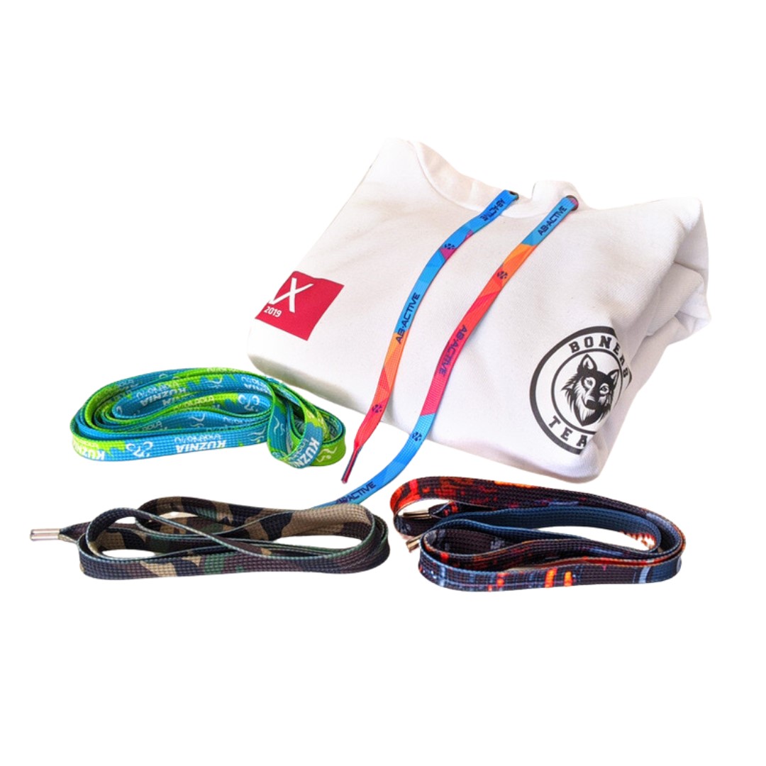 Shoe Laces with logo Step into style with our vibrant Colorful Shoe Laces, now customizable with your logo! These eye-catching accessories are the perfect way to add a pop of personality to your footwear while showcasing your brand with every step. Made from high-quality materials and available in a rainbow of hues, our shoe laces are designed to stand out and make a statement. Whether you're lacing up sneakers, boots, or dress shoes, these colorful laces are sure to turn heads and draw attention to your brand. Suggested shoelace length in regards to eyelets: 5 eyelets – 75cm 6 eyelets – 90cm 7 eyelets – 120cm Available Width: 9mm - 12mm - 16mm Additional costs: PLASTIC ENDINGS (9 or 11mm) 2pcs Production time is about 4 weeks. Magnus Business Gifts is your partner for merchandising, gadgets or unique business gifts since 1967. Certified with Ecovadis gold!